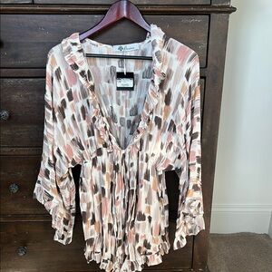 Pink plunge v-neck 3/4 sleeve blouse with ruffled tie front